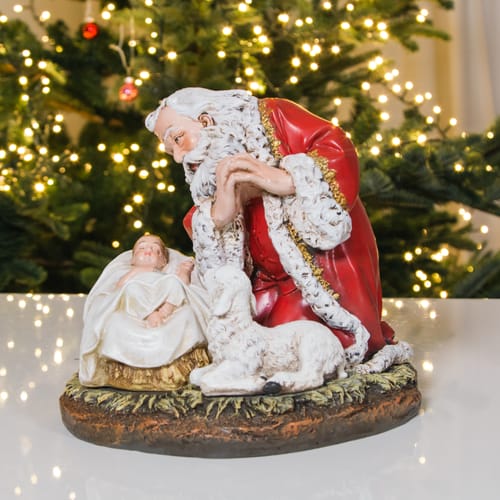 Kneeling Santa With Sleeping Babe