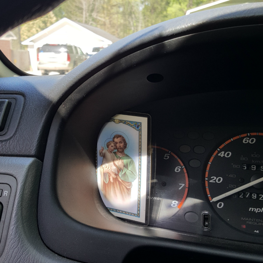 St. Joseph prayer card on the dashboard