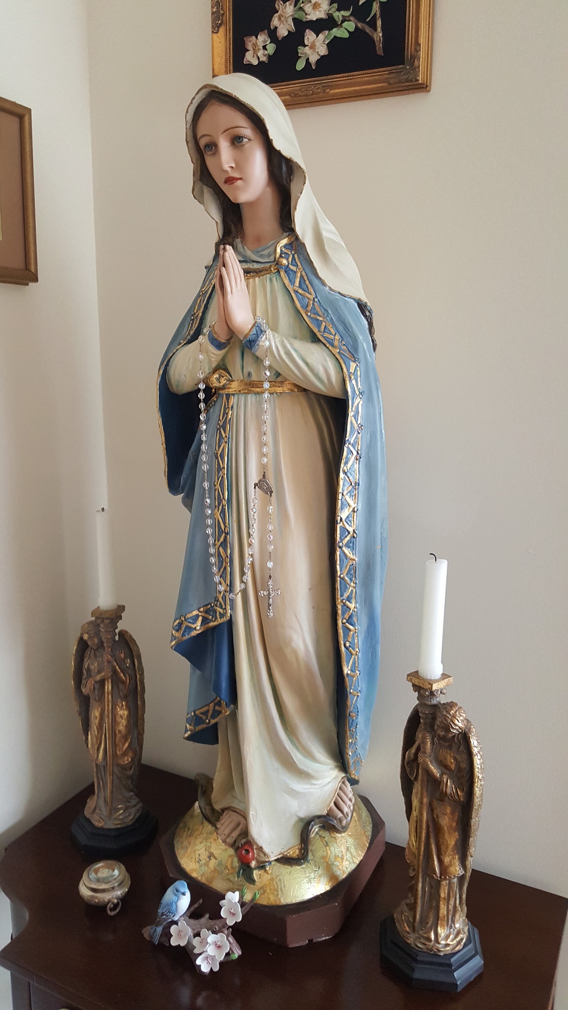 A statue of Our Lady in the bishop's home chapel that he rescued and had restored. It was hugged by Mother Teresa.